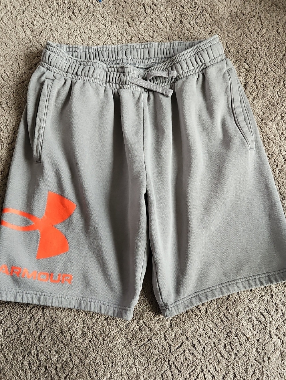 Under Armour Men’s Light Gray Athletic Shorts with Orange Logo